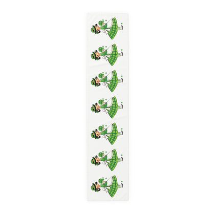 This table runner features a retro midcentury St. Patrick&#39;s Day illustration of a girl dressed in green, wearing a hat and holding shamrocks.