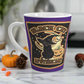 This 12 ounce ceramic glossy latte mug features Halloween distressed style print of a black cat wearing a witch's hat and says Black Cat Apothecary. There is a yellow moon and jack o'lantern.