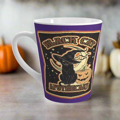 This 12 ounce ceramic glossy latte mug features Halloween distressed style print of a black cat wearing a witch's hat and says Black Cat Apothecary. There is a yellow moon and jack o'lantern.