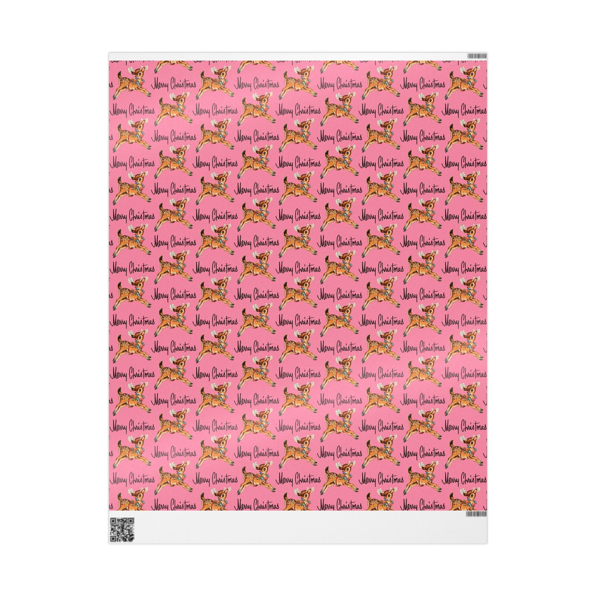 This pink gift wrap features a midcentury illustration of a leaping reindeer adorned with an ornament wreath around her neck. There is black lettering that says Merry Christmas.