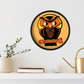 This black wooden wall clock features a retro illustration of an orange and black owl with a yellow full moon. The frame and hands of the clock are black.