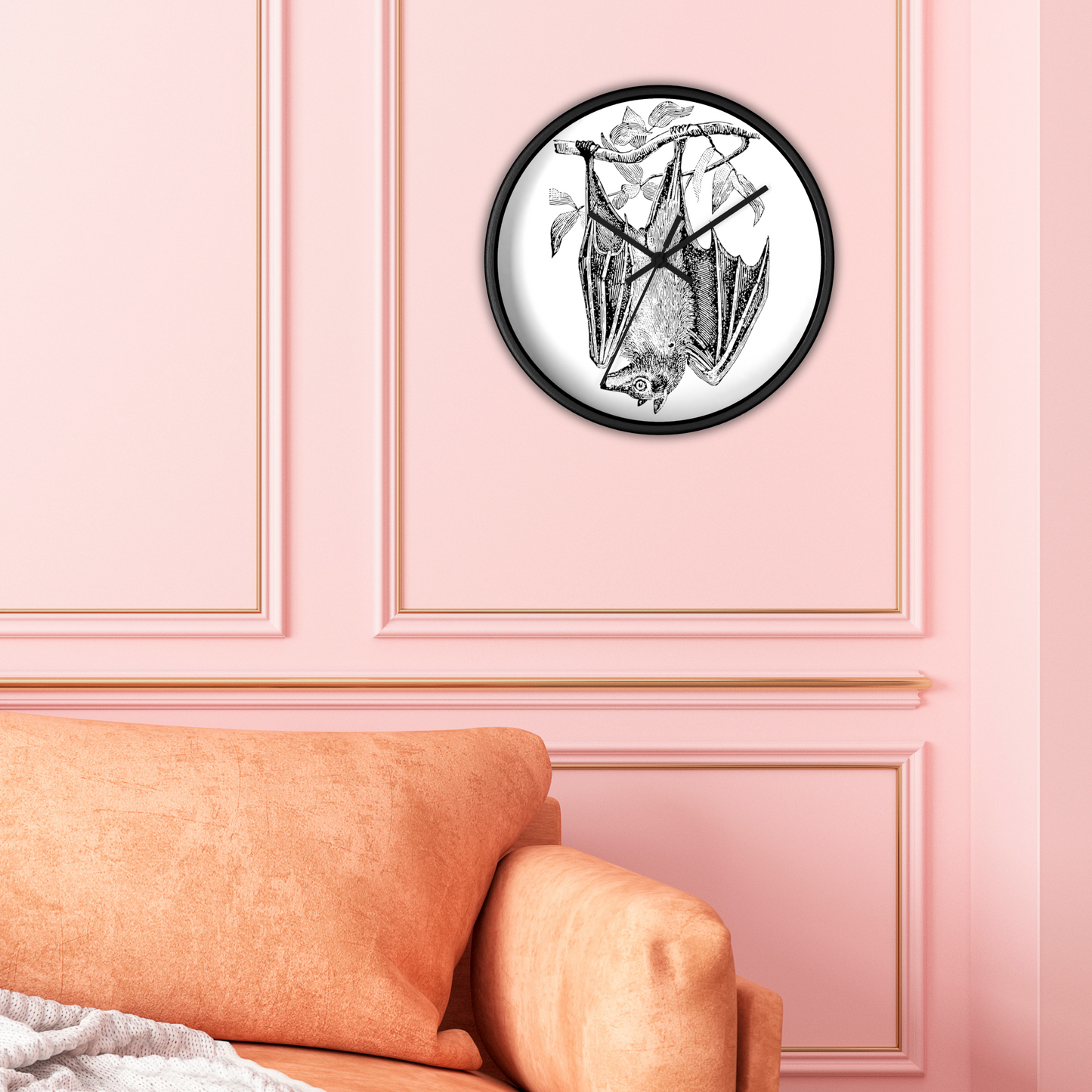 This black wall clock features a vintage illustration of a bat hanging upside down from a branch. The frame and hands of the clock are black.