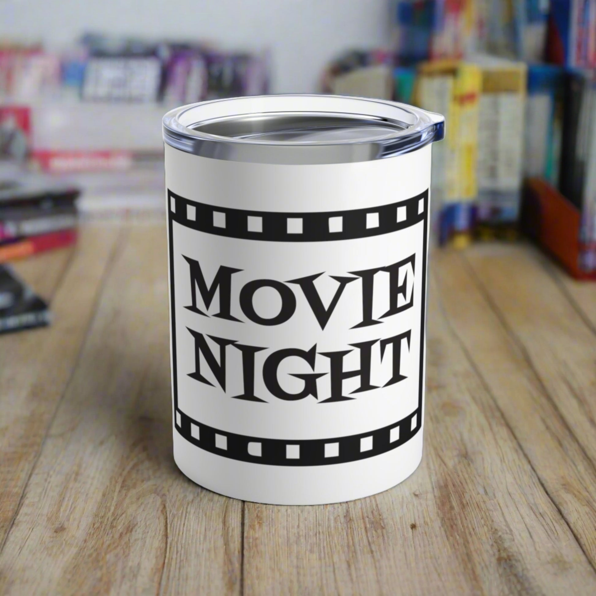 This 10 ounce stainless steel glossy tumbler has a black and white theme with retro atomic era lettering that says Movie Night with a film strip around the lettering.