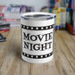 This 10 ounce stainless steel glossy tumbler has a black and white theme with retro atomic era lettering that says Movie Night with a film strip around the lettering.