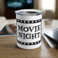 This 10 ounce stainless steel glossy tumbler has a black and white theme with retro atomic era lettering that says Movie Night with a film strip around the lettering.