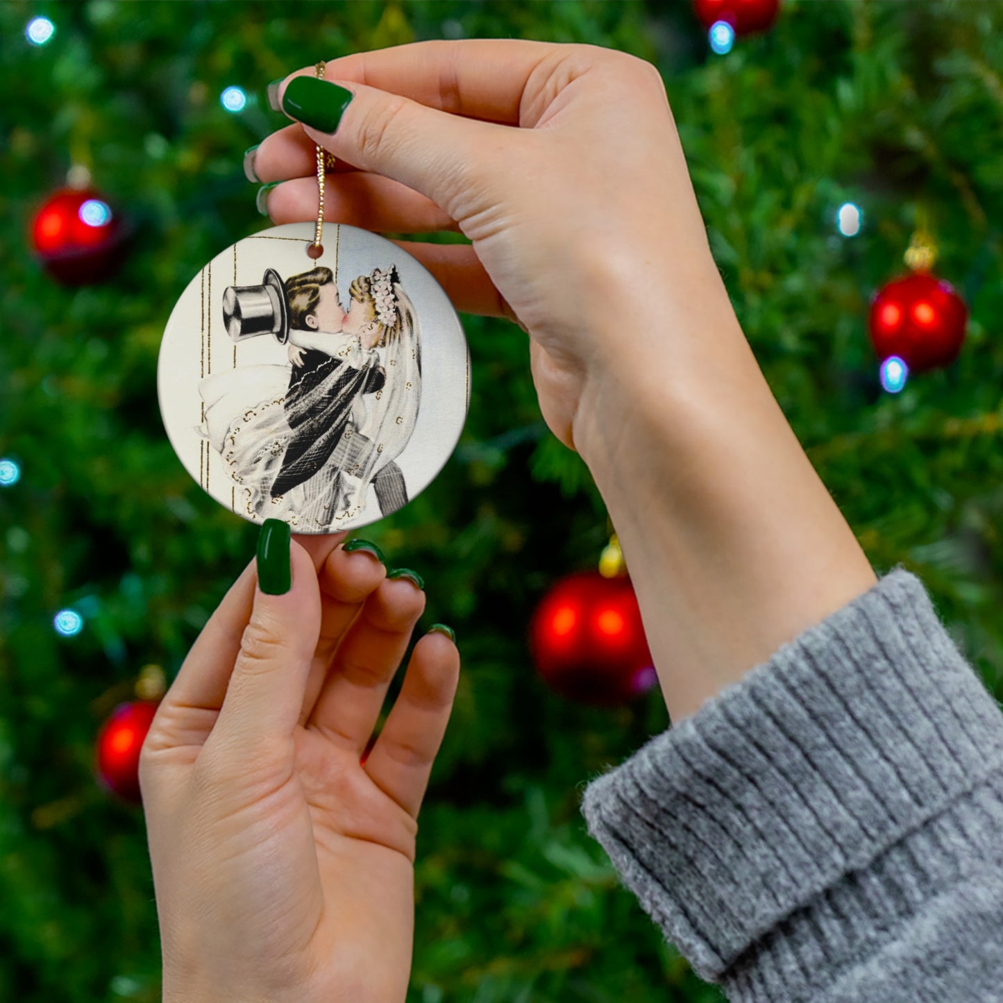 This round ceramic ornament features a vintage wedding illustration of a bride carrying his groom over the threshold while they share a kiss.