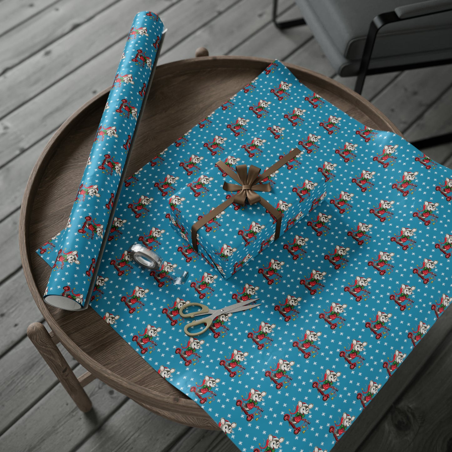 This Christmas gift wrap features a midcentury retro illustration of a cute mouse on a scooter wearing a Santa hat. The background is blue with white stars.