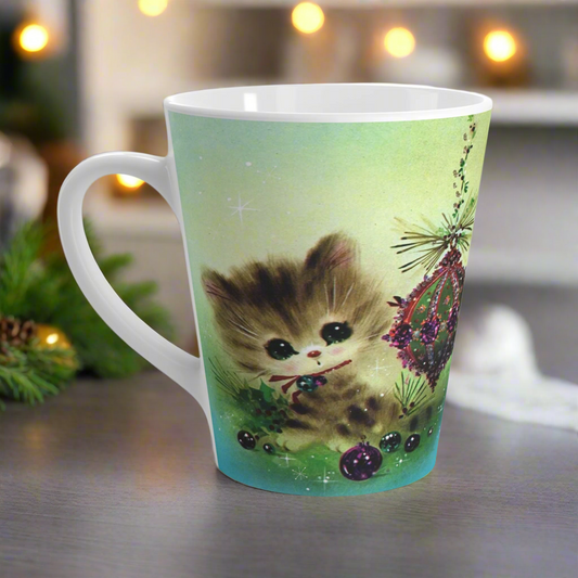 This ceramic glossy Christmas latte mug features an adorable Midcentury kitten sitting next to sparkling ornaments.