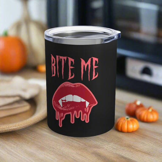 This 10 ounce stainless steel vacuum insulated black travel tumbler features vampire lips and fangs dripping with blood and the words Bite Me in Pink.