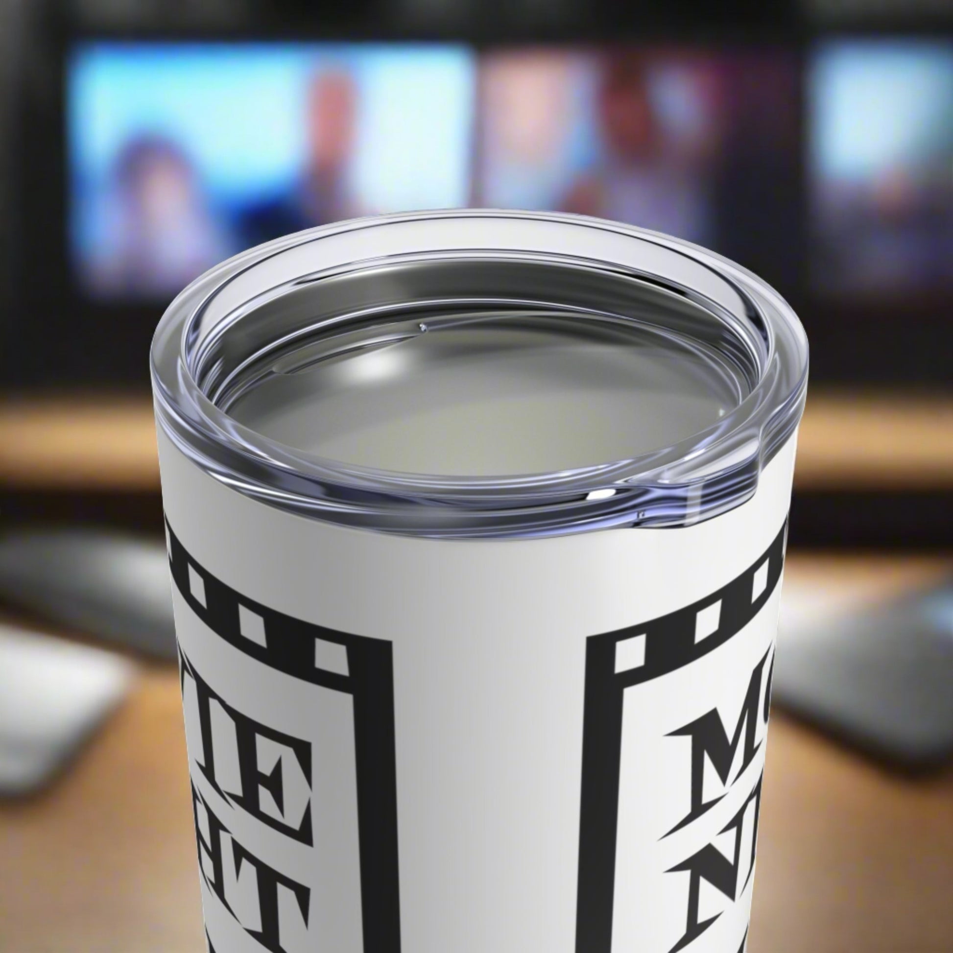 This 10 ounce stainless steel glossy tumbler has a black and white theme with retro atomic era lettering that says Movie Night with a film strip around the lettering.