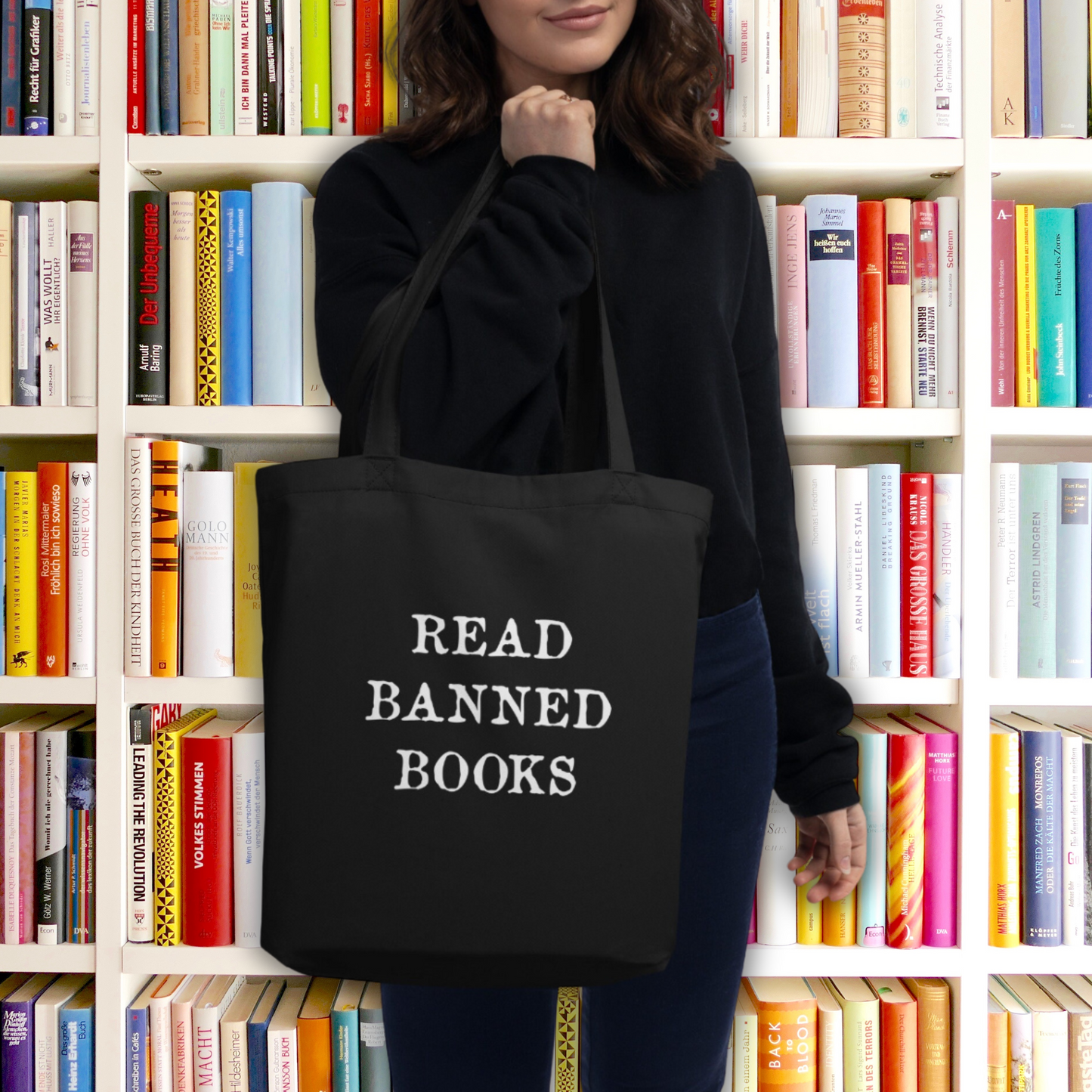 This large black eco cotton tote bag features white lettering that says in all capital letters Read Banned Books.