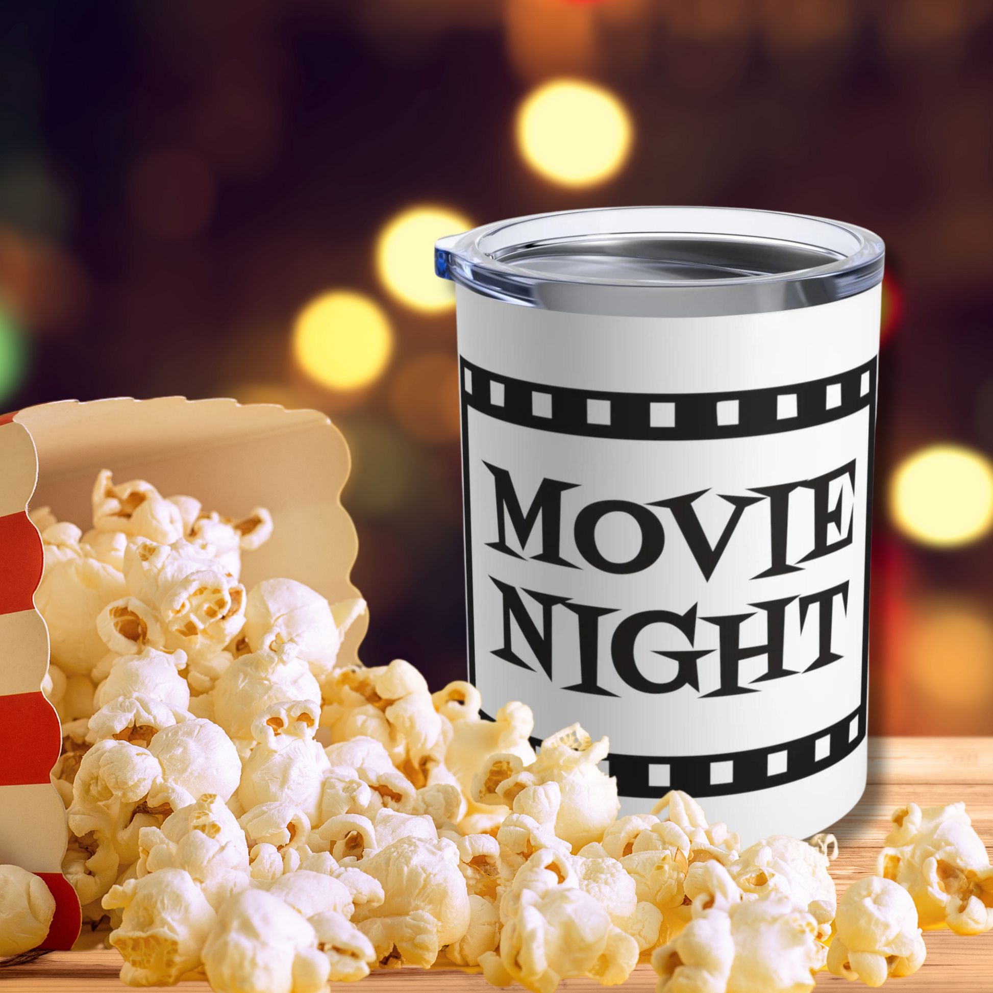 This 10 ounce stainless steel glossy tumbler has a black and white theme with retro atomic era lettering that says Movie Night with a film strip around the lettering.