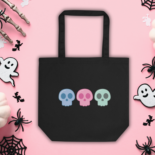 This large black eco cotton tote bag features cute pastel goth skulls in blue, pink and green.