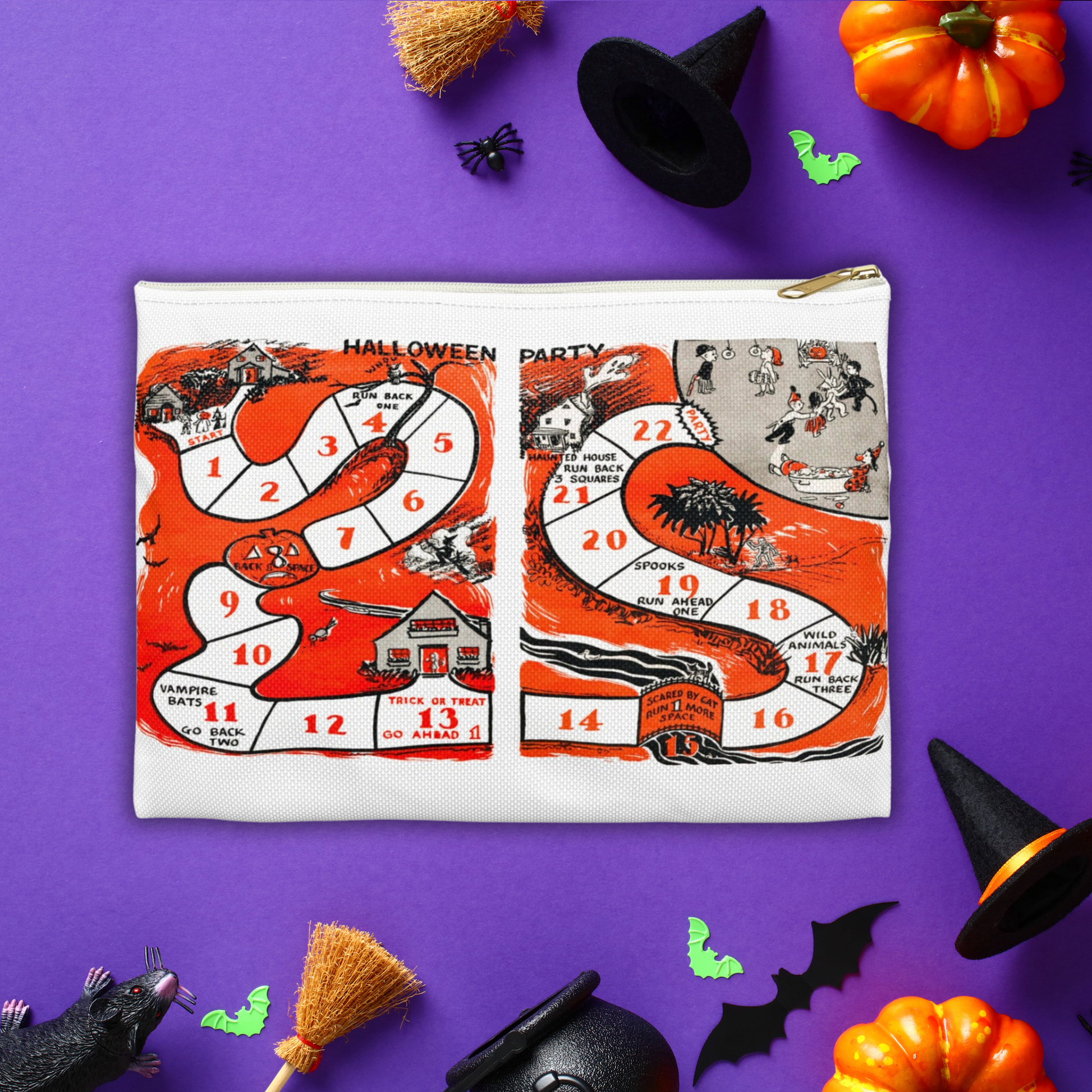 Halloween pouch travel bag. This white bag has a white zipper and gold puller. The design is a retro print of a Halloween Party Board game with adorable nostalgic artwork.