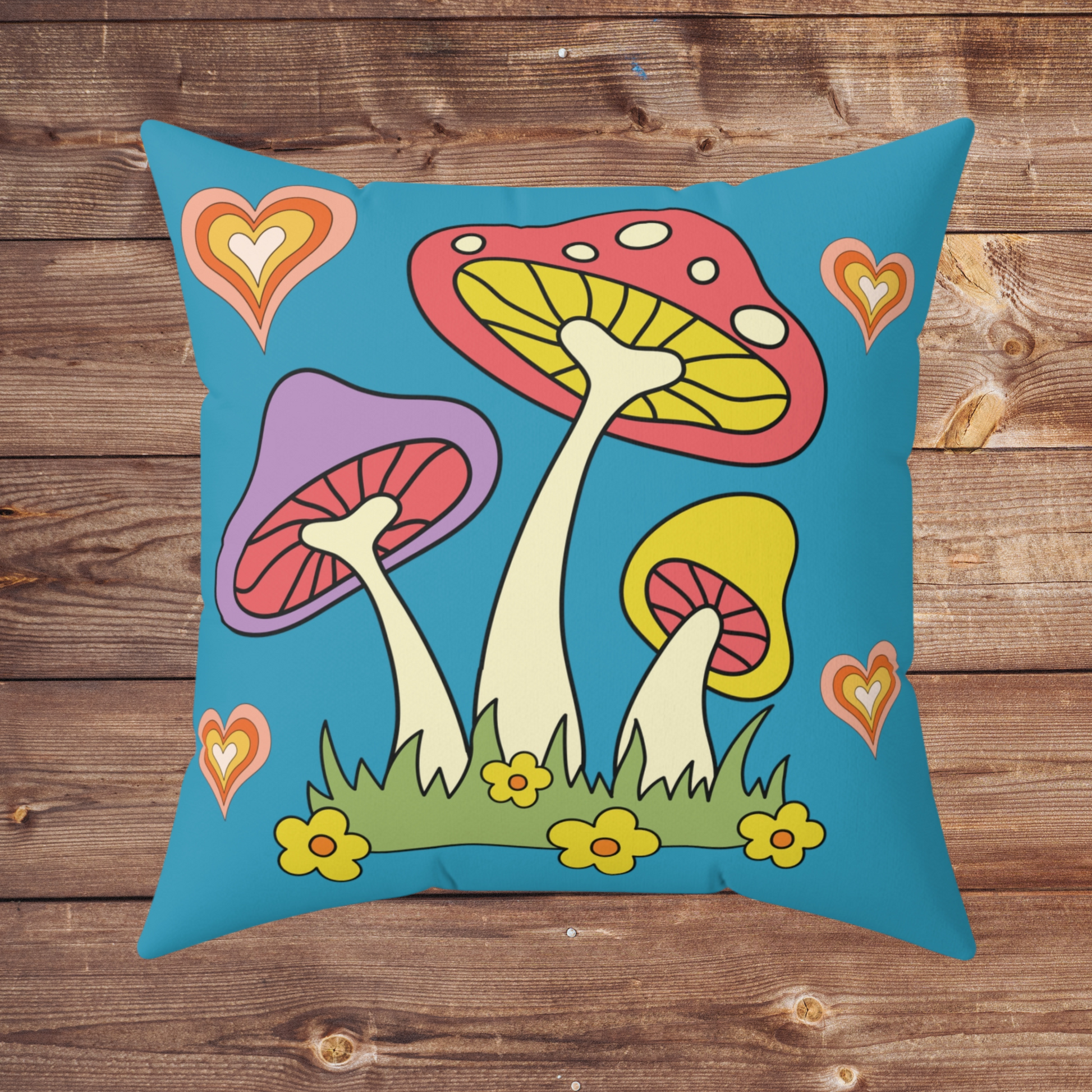 This polyester spun pillow features retro 70s style mushrooms, flowers and hearts with a vintage blue background.