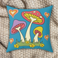 This polyester spun pillow features retro 70s style mushrooms, flowers and hearts with a vintage blue background.