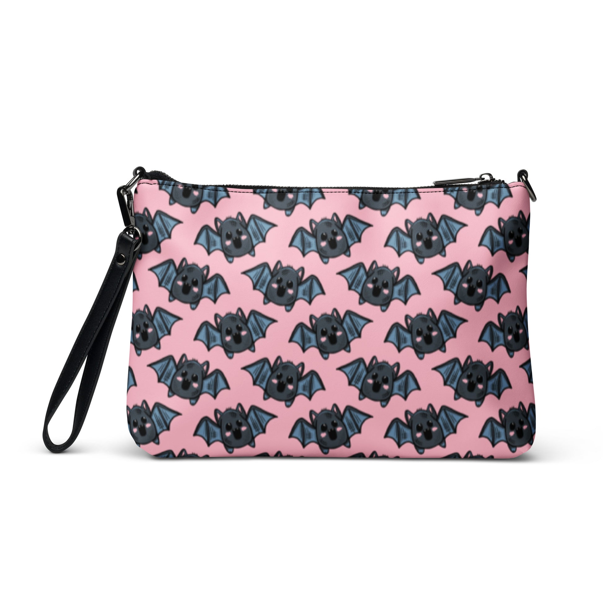 This crossbody shoulder purse converts into a large wristlet clutch. It features adorable grey bats with a pink background.