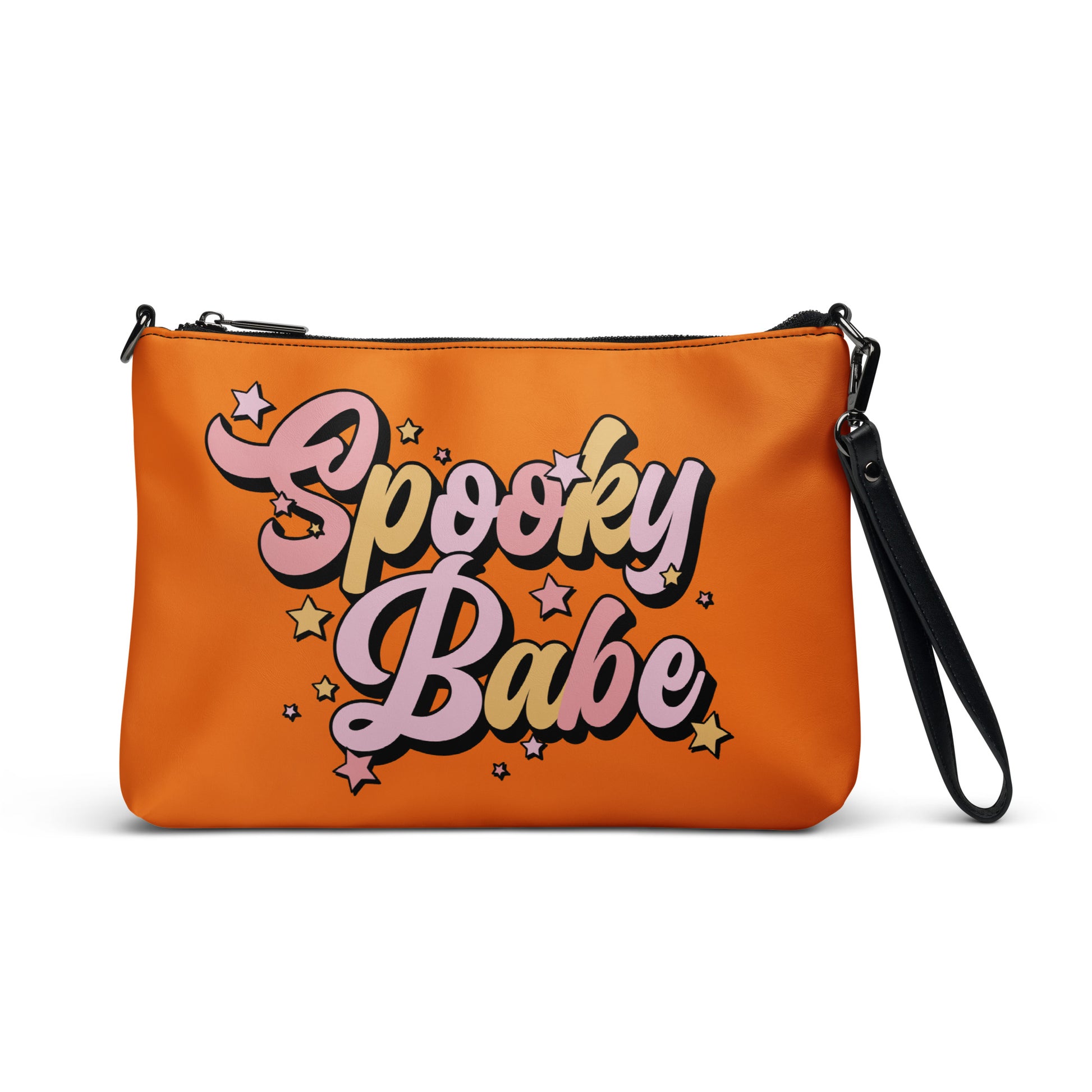 This orange crossbody purse features a retro Barbie style type of lettering that says Spooky Babe in fall pastel colors with stars.