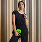 This black crossbody purse features a large red apple dipped in green poison with the words Bite Me underneath and the back is a small size in a patterned print.