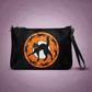 This black crossbody purse also features a wristlet strap as featured in this photo. The front of the purse features a retro Halloween print of a black cat with little black cats surrounding him in a circle with an orange circle with white stars around the moon.