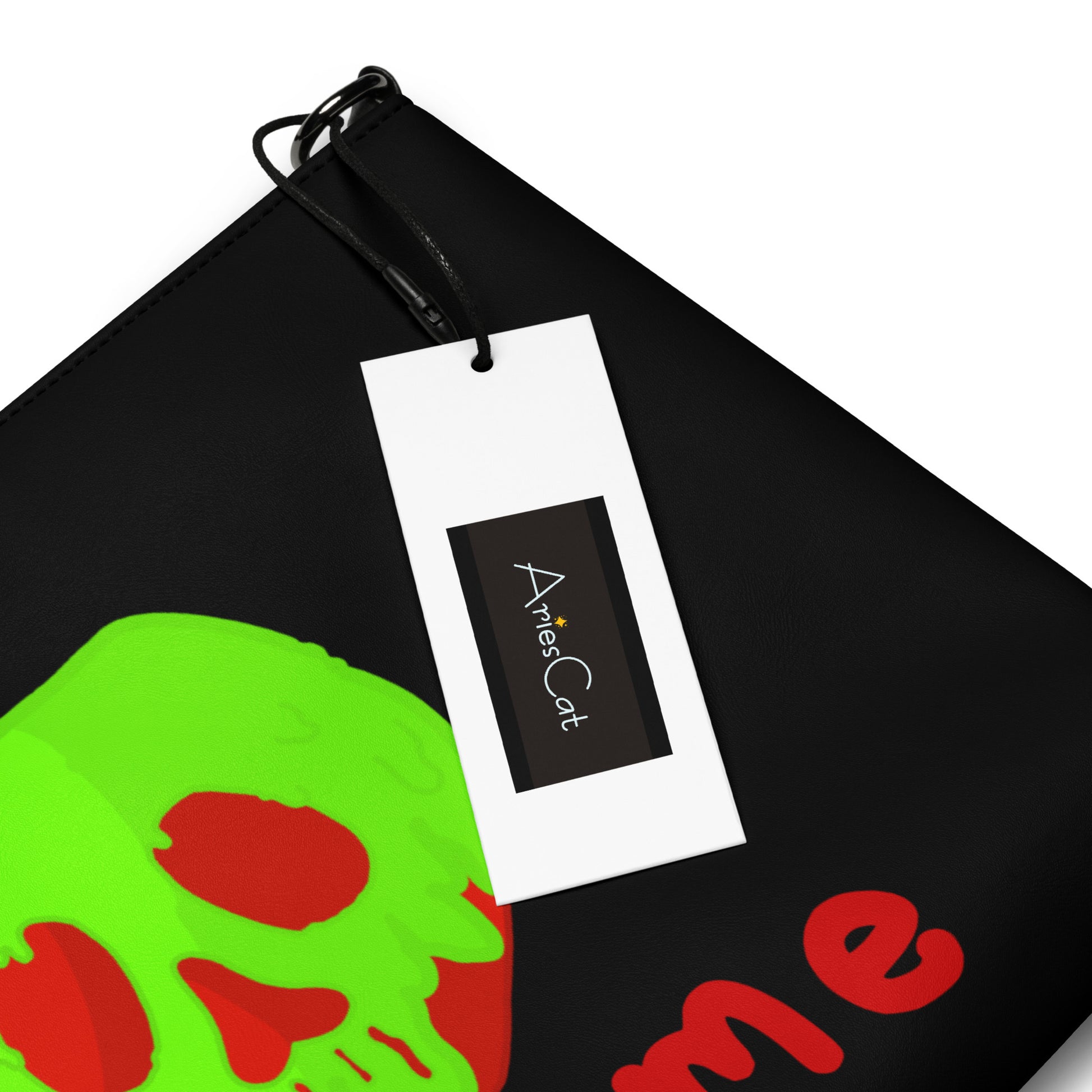 This black crossbody purse features a large red apple dipped in green poison with the words Bite Me underneath and the back is a small size in a patterned print.