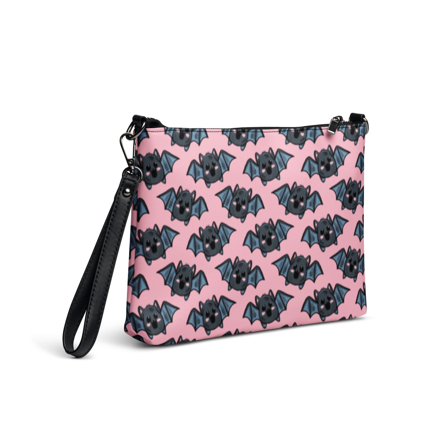 This crossbody shoulder purse converts into a large wristlet clutch. It features adorable grey bats with a pink background.