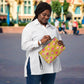 This yellow crossbody purse features the cute smoking caterpillar on one side and pink mushrooms on the other. It's a shoulder bag that converts into an oversized wristlet clutch.