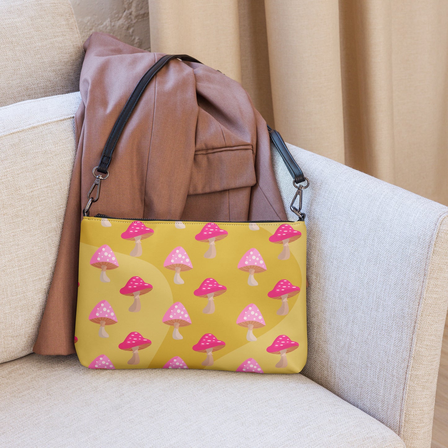 This yellow crossbody purse features the cute smoking caterpillar on one side and pink mushrooms on the other. It's a shoulder bag that converts into an oversized wristlet clutch.