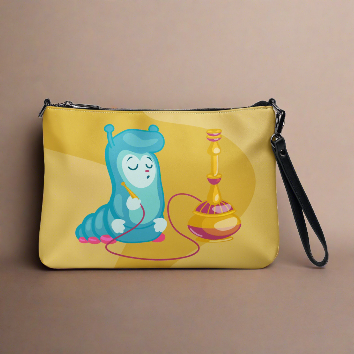 This yellow crossbody purse features the cute smoking caterpillar on one side and pink mushrooms on the other. It's a shoulder bag that converts into an oversized wristlet clutch.