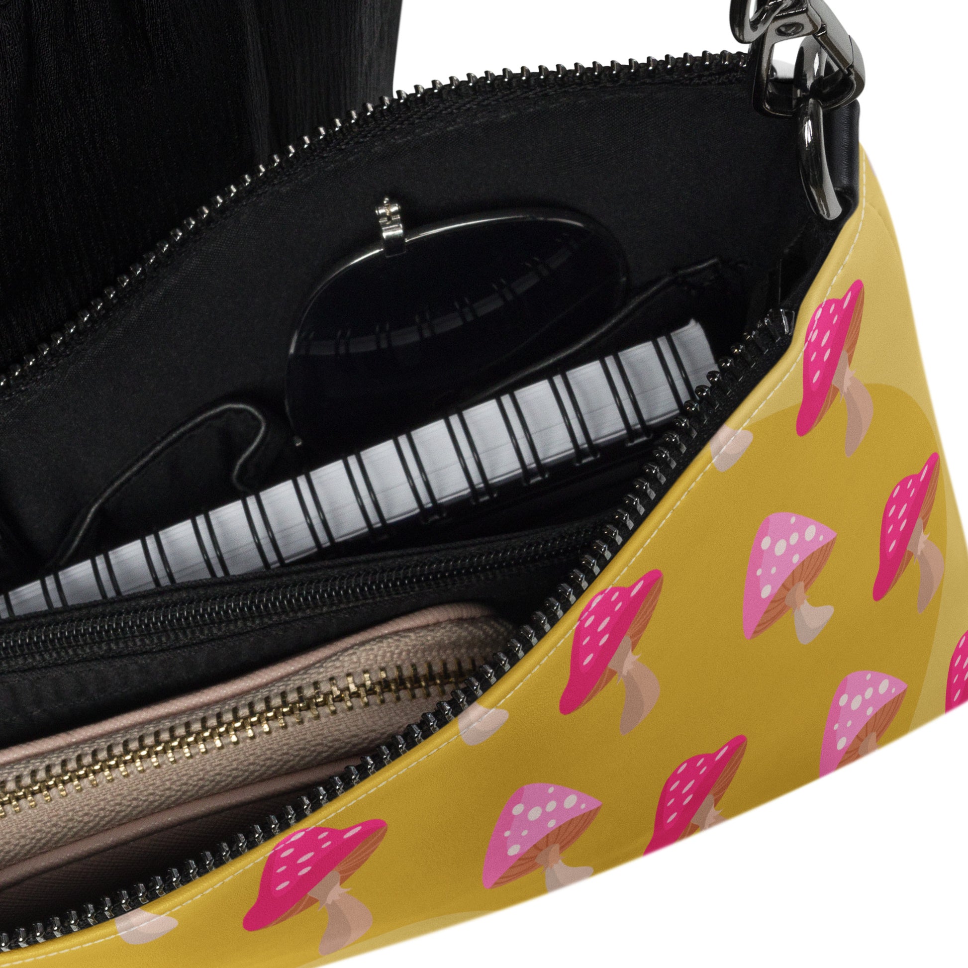 This yellow crossbody purse features the cute smoking caterpillar on one side and pink mushrooms on the other. It's a shoulder bag that converts into an oversized wristlet clutch.