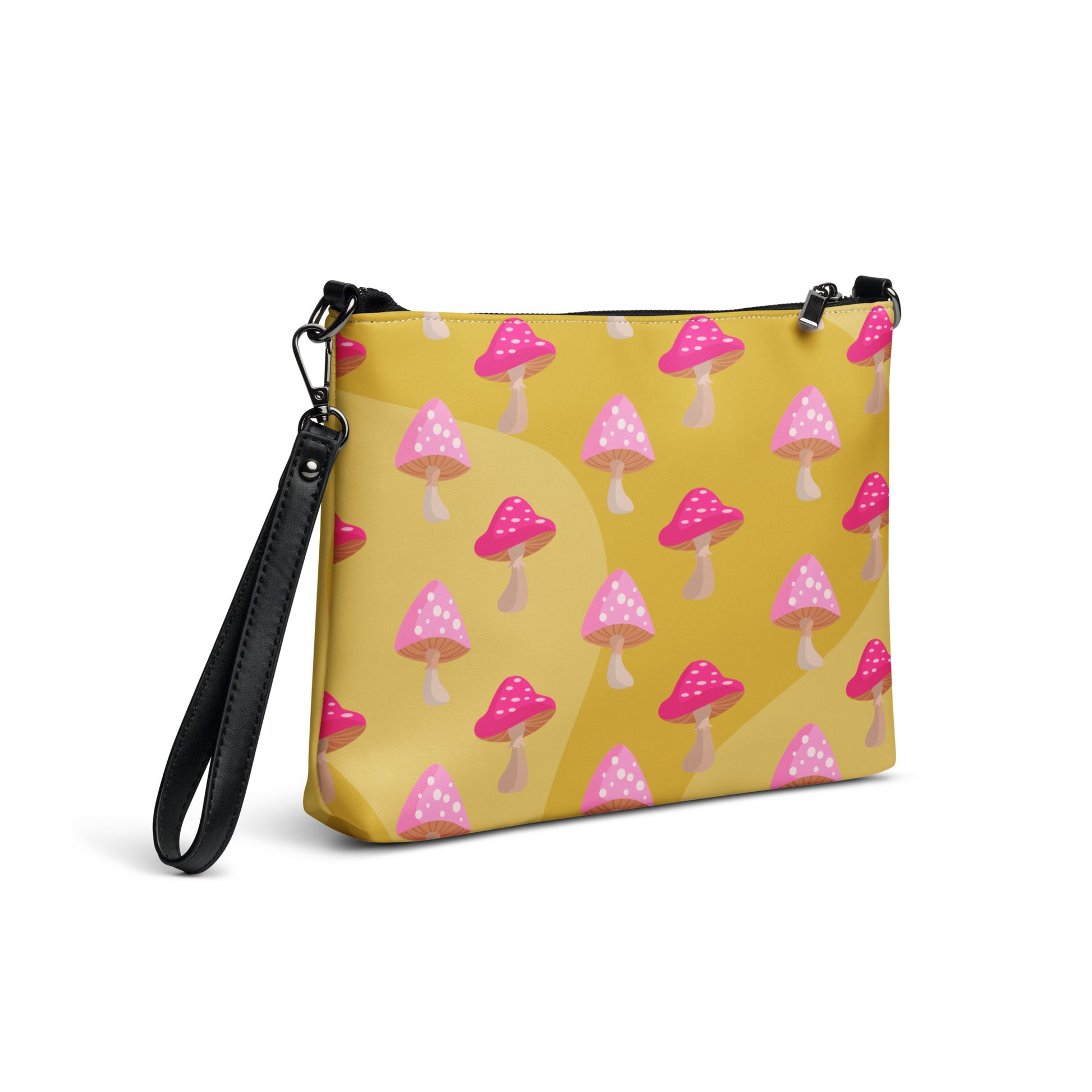 This yellow crossbody purse features the cute smoking caterpillar on one side and pink mushrooms on the other. It's a shoulder bag that converts into an oversized wristlet clutch.