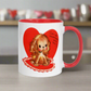 This ceramic glossy coffee cup features a vintage midcentury Valentine's Day illustration of a golden puppy sitting on a heart rug. There is a heart behind her that says Can I be Valentines with you?