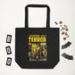 This largo eco cotton black tote bag features a vintage comic book cover titled Adventures Into Terror. It features a couple with a lantern surrounded by skeletons.