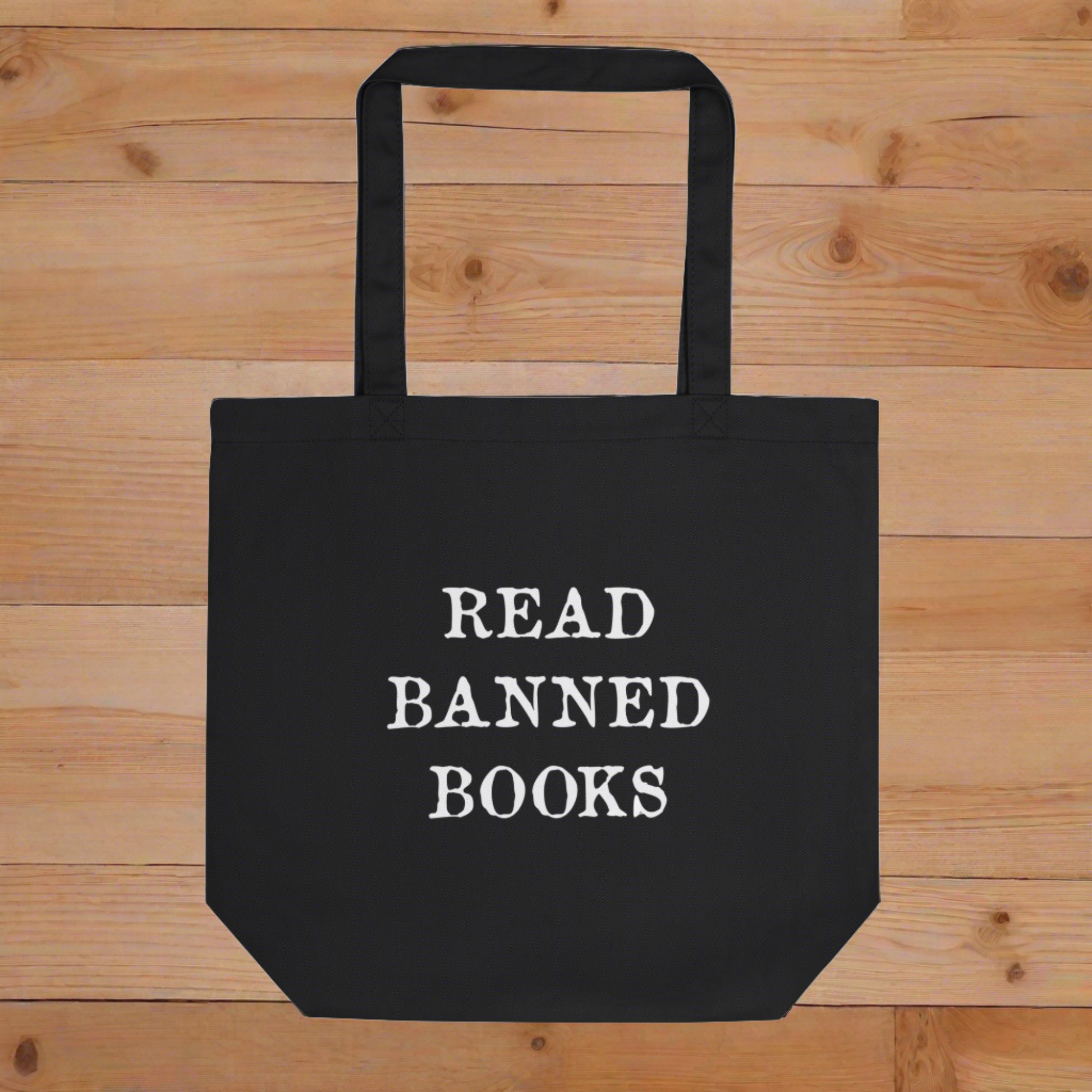 This large black eco cotton tote bag features white lettering that says in all capital letters Read Banned Books.