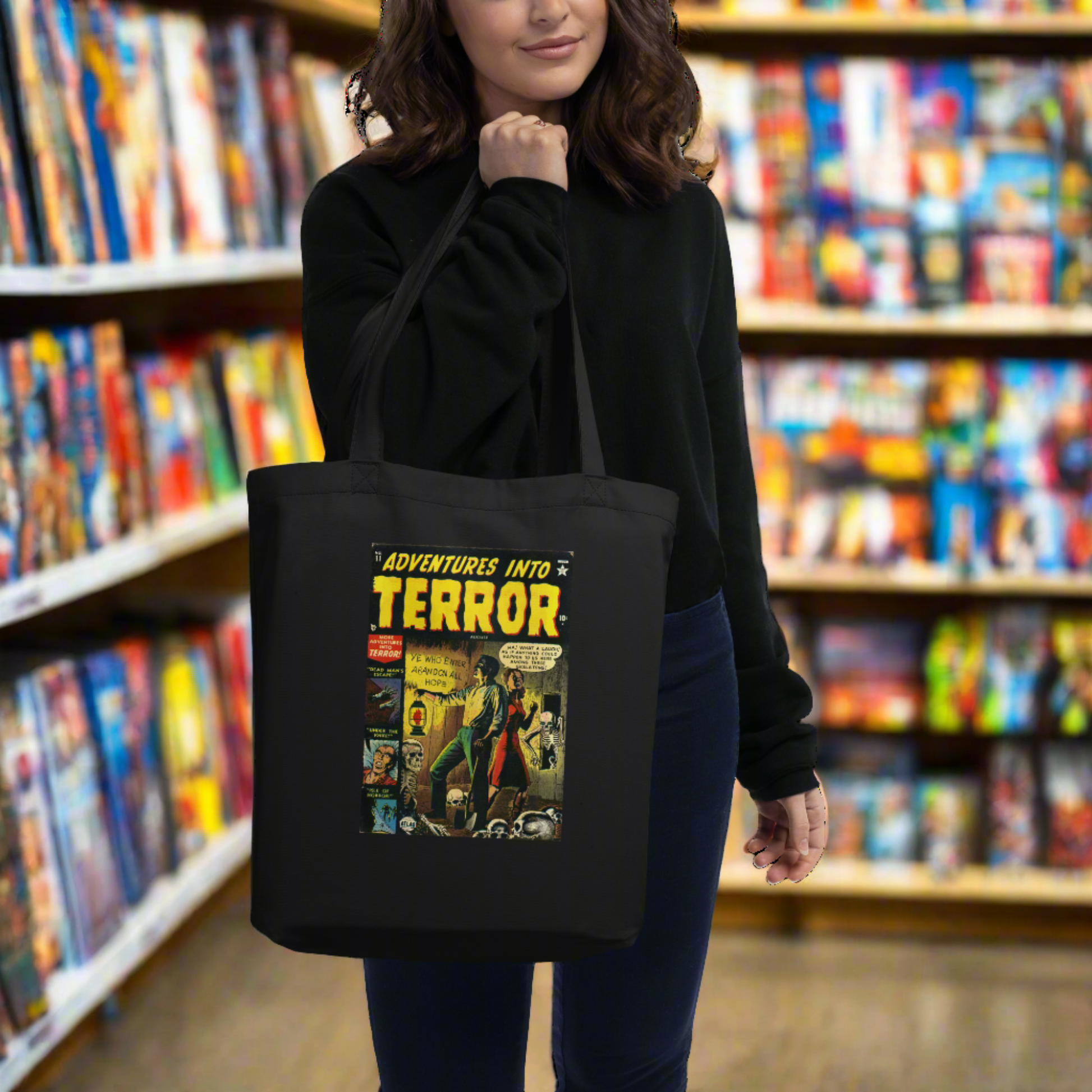 This largo eco cotton black tote bag features a vintage comic book cover titled Adventures Into Terror. It features a couple with a lantern surrounded by skeletons.