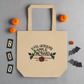 This tote bag says Evil Queen's Apple Orchard U-Pick We Poison and there is a basket of red apples with a poisoned green apple on the O in Orchard.