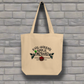 This tote bag says Evil Queen's Apple Orchard U-Pick We Poison and there is a basket of red apples with a poisoned green apple on the O in Orchard.