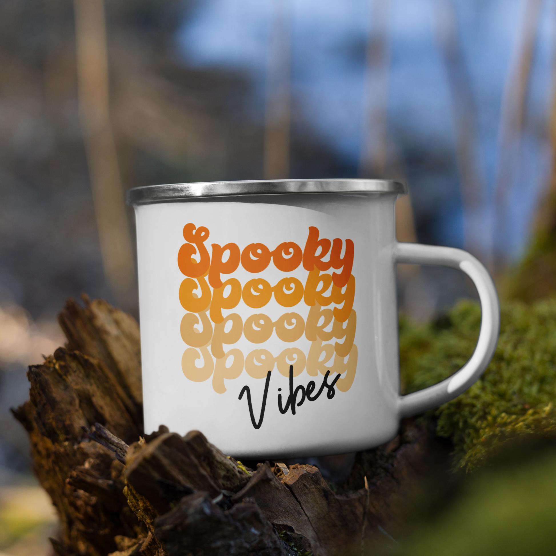 This 10 ounce enamel camping mug features a retro style font that says Spooky four times in various shades of orange with vibes in black.