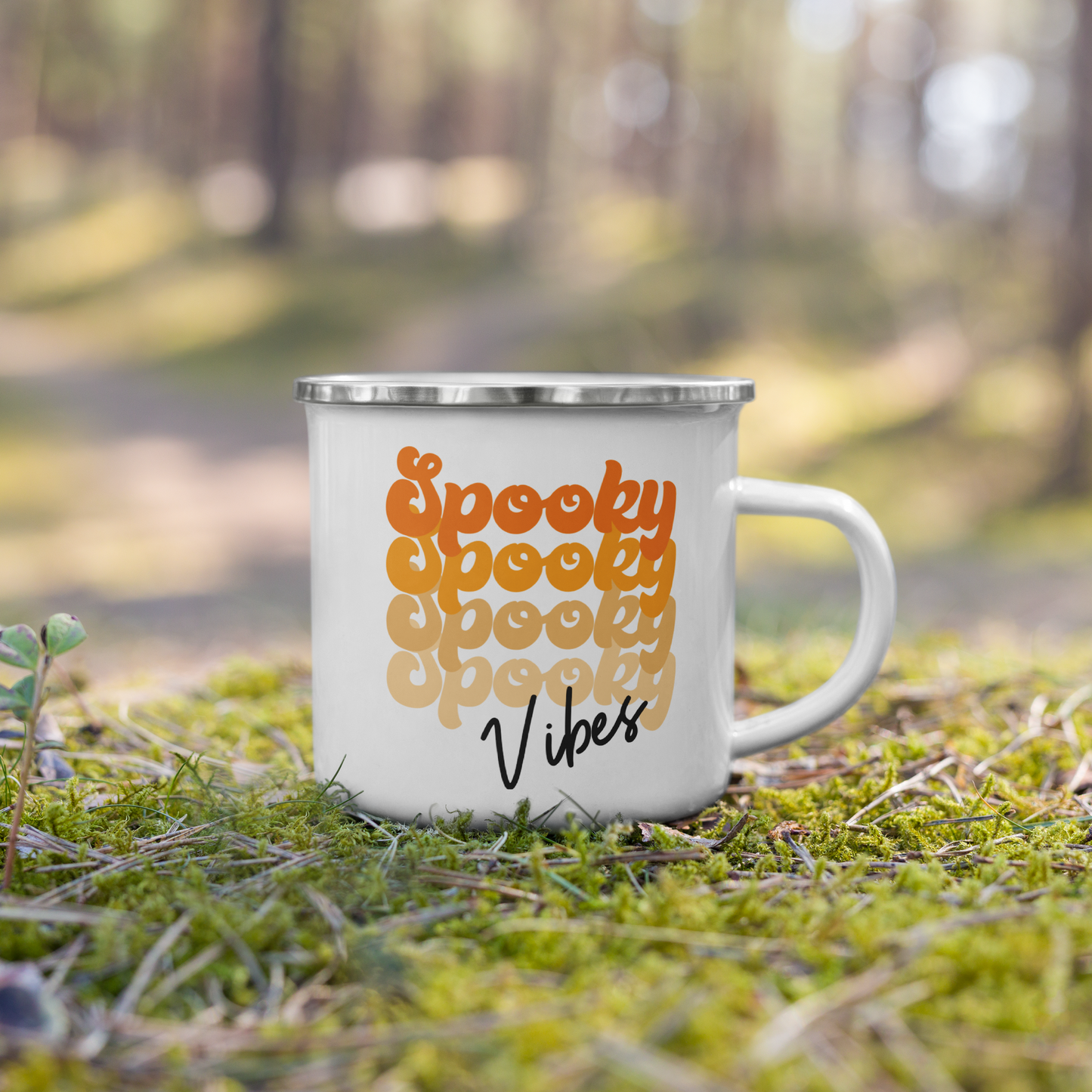 This 10 ounce enamel camping mug features a retro style font that says Spooky four times in various shades of orange with vibes in black.