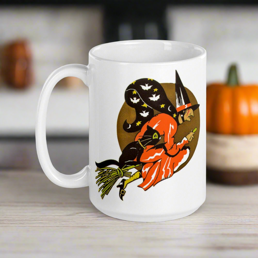 This ceramic glossy coffee mug features a retro vintage Halloween print of a witch flying on her broom with her black cat and a gold moon in the background.