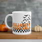 This ceramic glossy Halloween mug features a retro style print that says Halloween Vibes Only. There are flying bats and a black and white checkered print at the bottom.