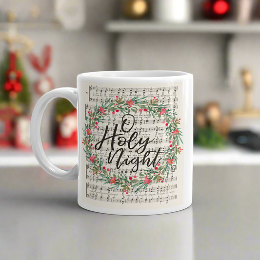 This ceramic glossy Christmas coffee mug features vintage  hymn music with a wreath over it saying O Holy Night. 