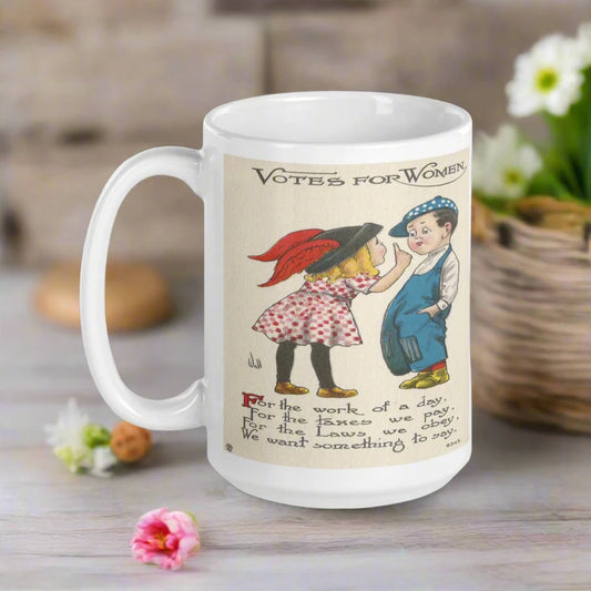 This ceramic glossy mug features a vintage illustration of a boy and girl that says Votes For Women. The girl is saying: For the work of a day, For the taxes we pay, For the Laws we obey, We want something to say.