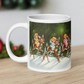 This ceramic glossy mug features three young angels riding reindeer in the snow.