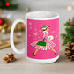 This ceramic glossy mug features a vintage Christmas illustration of a retro Midcentury housewife dressed in a pink and white striped dress with a green purse and heels. The background is pink and there are snowflakes. 