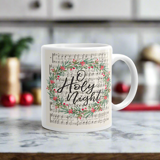 This ceramic glossy Christmas coffee mug features vintage  hymn music with a wreath over it saying O Holy Night. 