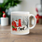 This ceramic glossy coffee mug features a vintage Christmas illustration of a snowy winter scene in the country. There is a red barn and a horse pulling a red sleigh with a Christmas tree.