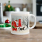 This ceramic glossy coffee mug features a vintage Christmas illustration of a snowy winter scene in the country. There is a red barn and a horse pulling a red sleigh with a Christmas tree.