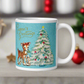 This glossy ceramic coffee mug features 
 Midcentury vintage artwork of an adorable reindeer with holly in her mouth, bunnies, and a Christmas Tree. There is gold lettering that says Season's Greetings and a blue felt background.