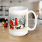 This ceramic glossy coffee mug features a vintage Christmas illustration of a snowy winter scene in the country. There is a red barn and a horse pulling a red sleigh with a Christmas tree.